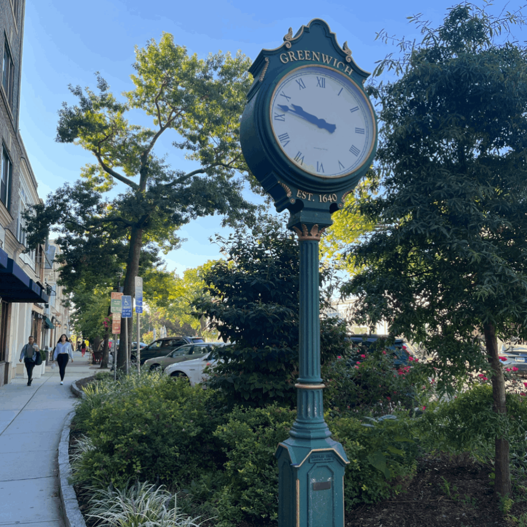 green standing clock in downtown Greenwich